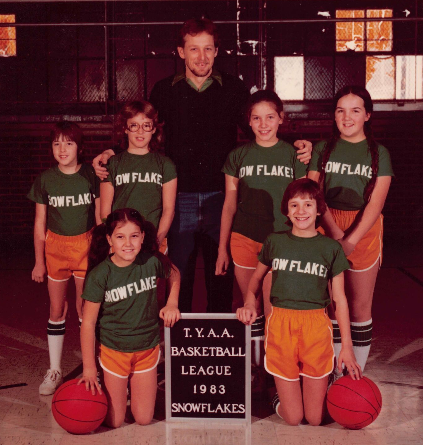 John with hand on Angie, and the TYAA Basketball League team Snowflakes 1983